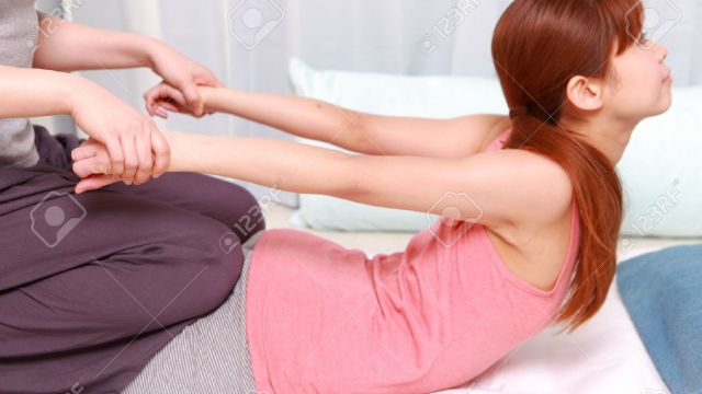 31876006-Japanese-Woman-Getting-Thai-Massage-Stock-Photo.jpg